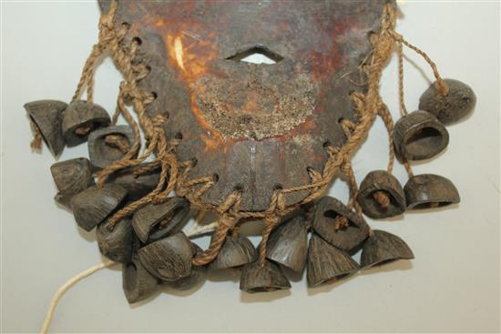 A tribal carved bone mask, 8.5in.